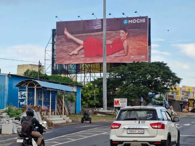 ECR road thiruvanmayur day view hoarding ad.